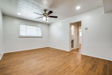 Empty room featuring light wood-style floors, rece