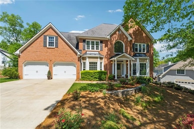 Traditional-style home featuring concrete driveway