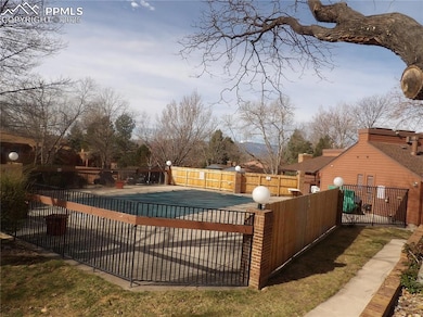 View of swimming pool featuring a fenced in pool, 