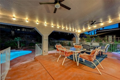 View of patio / terrace featuring ceiling fan, out