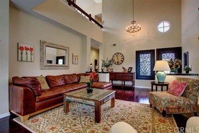 Formal living room with soaring 2 story ceiling an