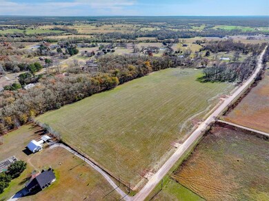 Birds eye view of property with a rural view