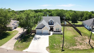 View of subject property featuring a heavily wood