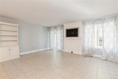 Spacious family room with tile floors, beatiful cu