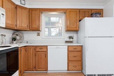 Kitchen with window pass through to the sun room