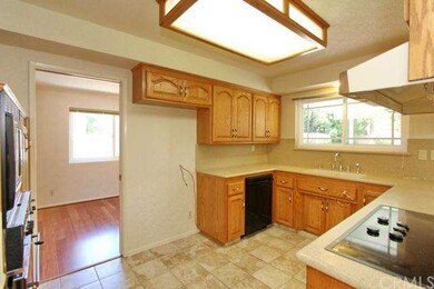 Kitchen opening into formal dining room. New count