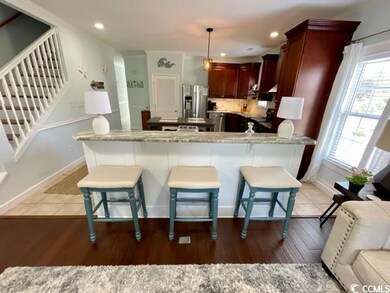 Kitchen with decorative light fixtures, plenty of 