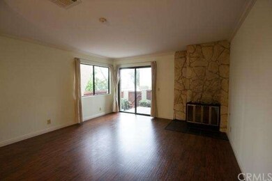 Big living room with new laminated wood floor.