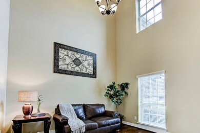 Sellers are using  the downstairs study as a sitting room. So cozy for such a large space! Great windows and a two story ceiling.