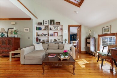Open concept great room with skylights.