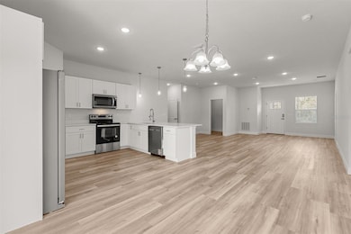 View from back sliders to Kitchen.