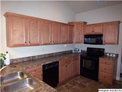 Lots of cabinets, counter tops and a pantry!