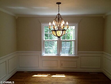 Dining Room - Hardwood Floors, Wainscoting and a s