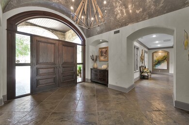 Elegant gallery hallway off foyer leads to home of