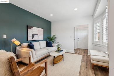 Living area with recessed lighting and wood finished floors