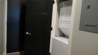 Clothes washing area with stacked washer and dryer