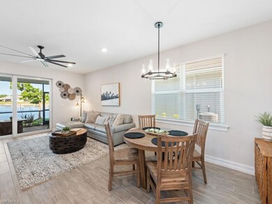 Dining room featuring light wood-type flooring, ce