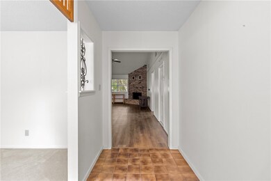 Corridor featuring baseboards