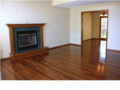Living Room with fireplace and real hardwood floor
