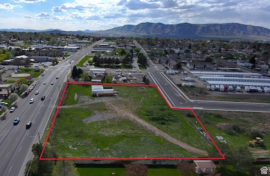 Birds eye view of property with a mountain view and a residential view