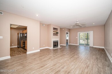 Open concept living space w/ fireplace