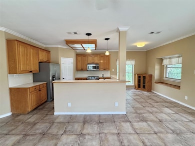 Kitchen with stainless steel appliances, crown mo