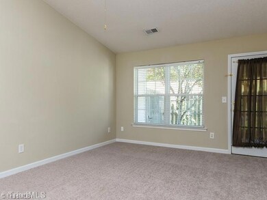 Den/Family/Great Room. The living room is spacious and has a vaulted ceiling.