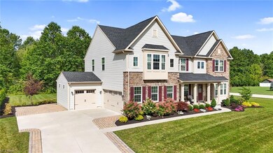 View of front of property with garage and a front 
