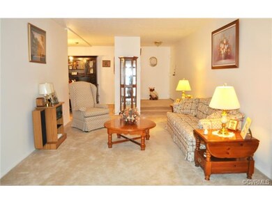 This living room view depicts the front entrance f