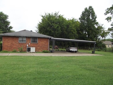 view of side 3 car covered carport