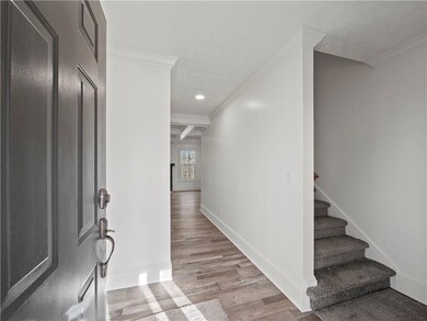 Entryway featuring crown molding, beamed ceiling, 