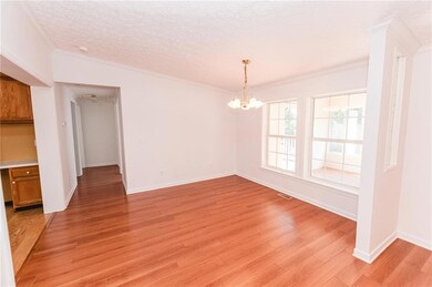 Unfurnished dining area featuring a chandelier, a 
