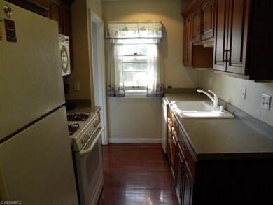 Gleaming Cherry Floors in Kitchen.