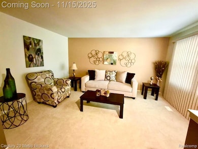 Living room featuring light carpet