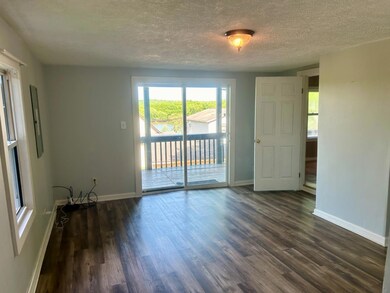 Living Room with sliding door to Front Deck