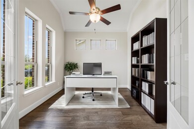 Through the double French Doors at the left of the entry is your private home office.  Plenty of natural light for those work from home days.