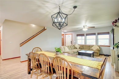A view from the kitchen of the dining and living spaces.