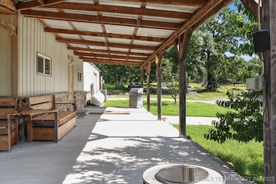 Covered Porch and view of Driveway