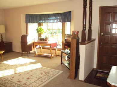 Neutral Paint Colors and Carpet Throughout.