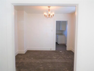 A formal Dining Room is spacious and bright.
