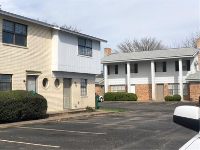 View of front of home featuring uncovered parking