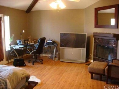 Enormous master with vaulted ceilings and a firepl