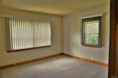 Additional angle of living room, viewed from kitch