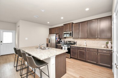 Spacious kitchen with ample storage and a large island perfect for additional seating.