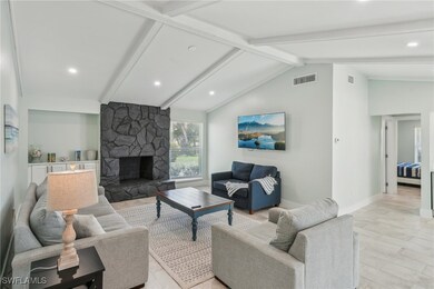 Living room featuring recessed lighting, a firepla