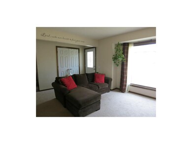 Enter into the living room with a large window ove