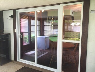 Nicely finished sun porch with newer carpet and ti