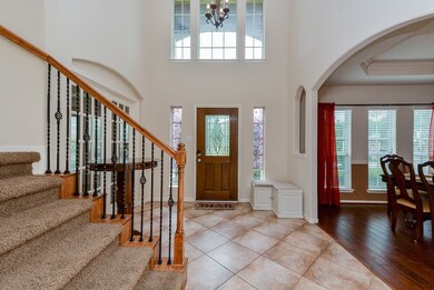 Two story entry is open and bright.