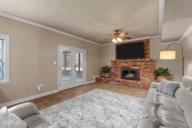 Living area with light tile patterned floors, orna