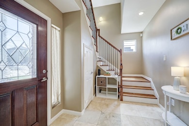 Inviting entry. First floor features a bedroom wit
